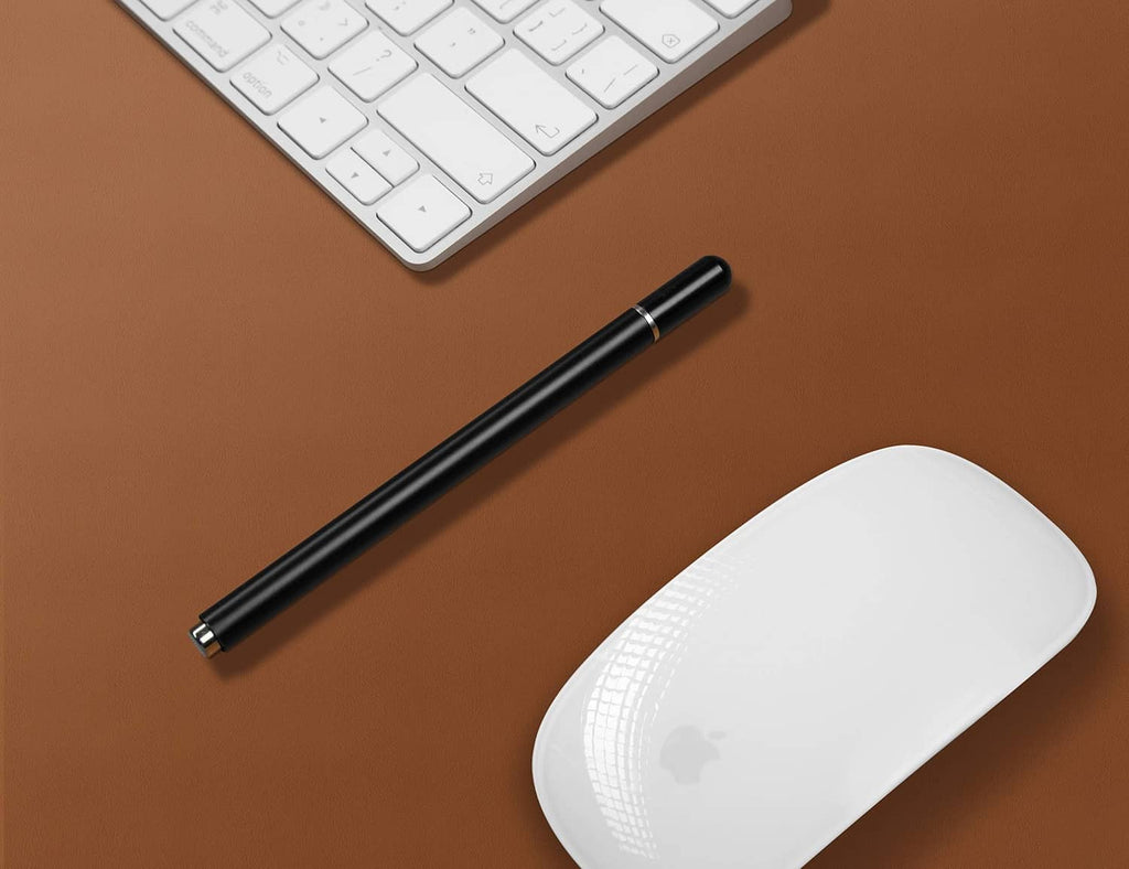 Brown leather desk pad surface with keyboard, pen, and white wireless mouse on top.