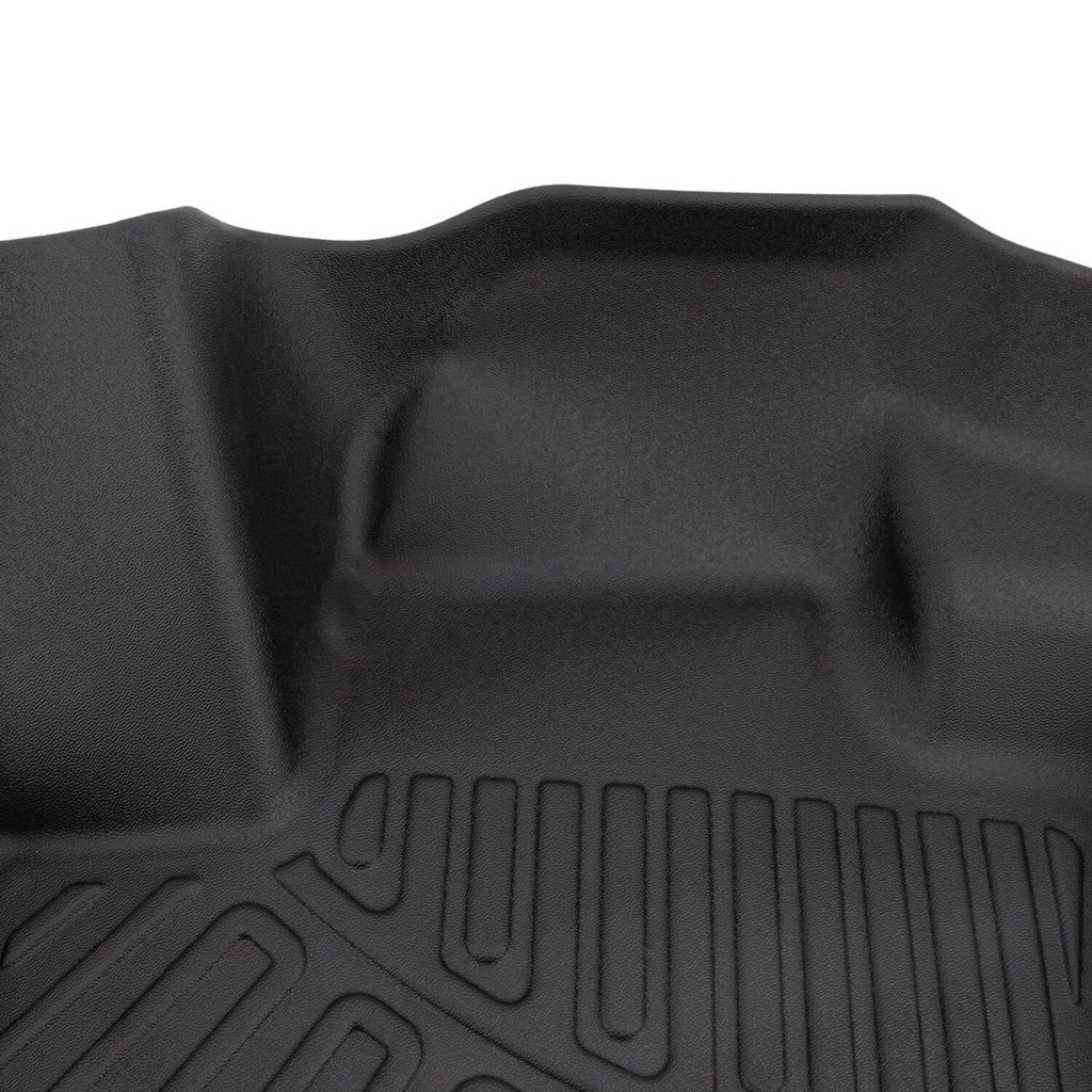 Close-up of black floor mat raised center section with molded traction ribs