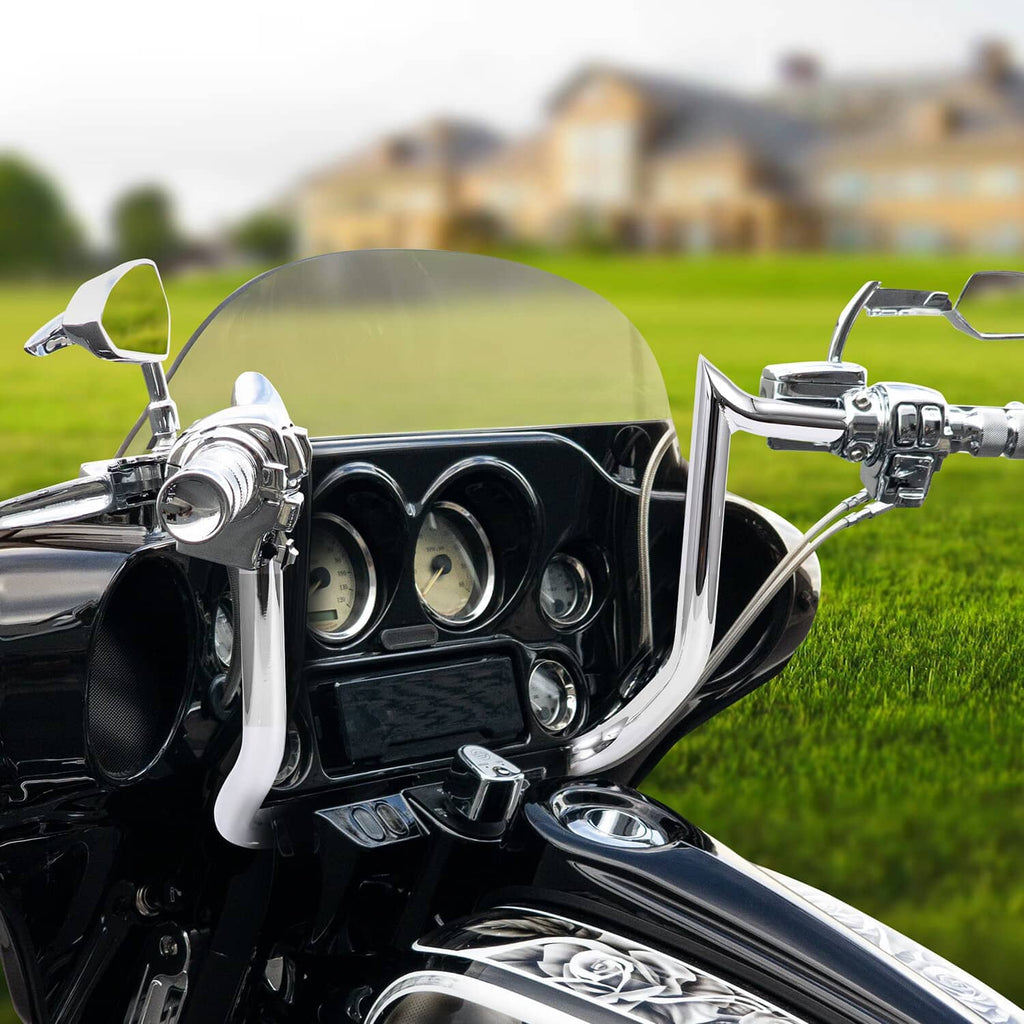 Chrome ape hanger handlebars installed on a touring motorcycle with instrument cluster