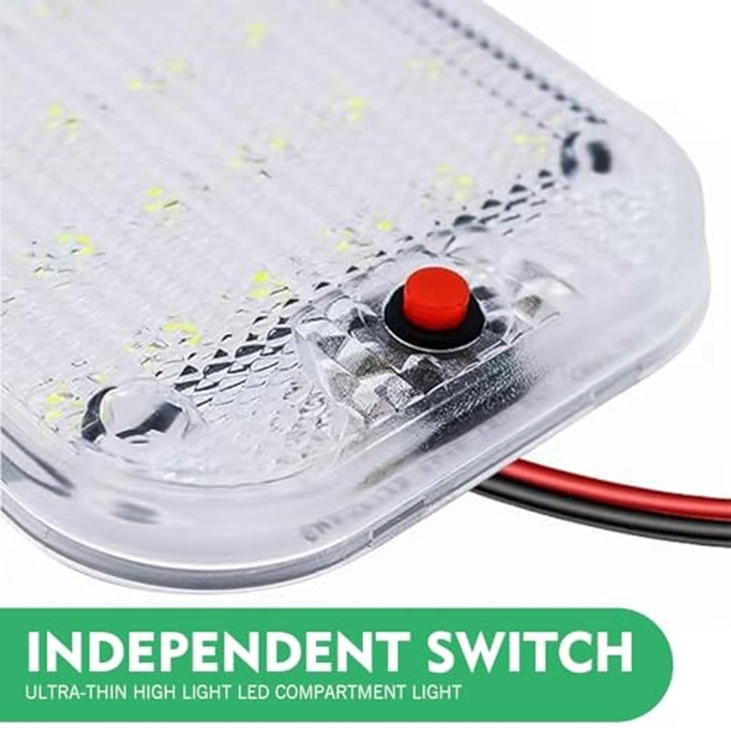 Close-up of clear LED cab dome light showing red button and yellow LED array with wiring