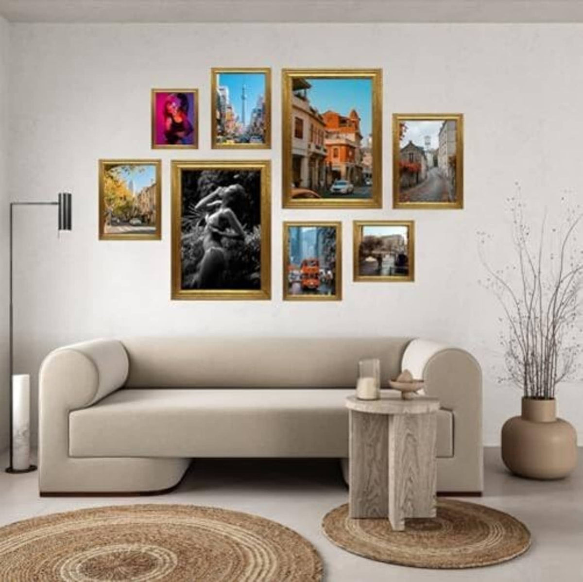 Multiple gold photo frames on a wall above a sofa, ornate borders on display.