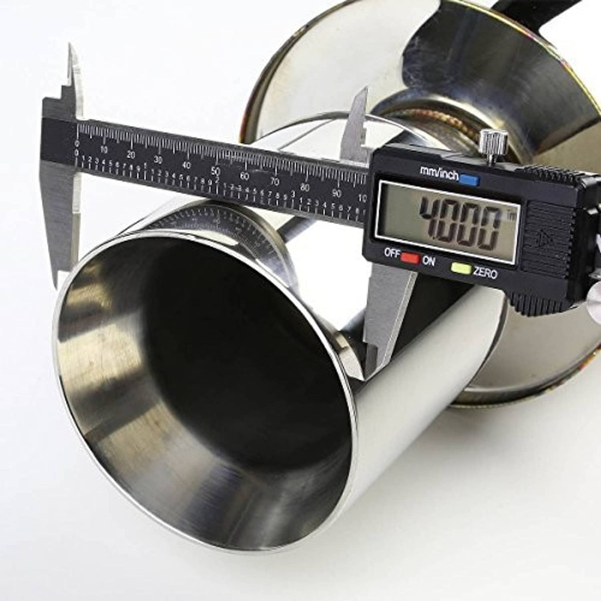Stainless steel exhaust outlet with digital caliper measuring the pipe diameter