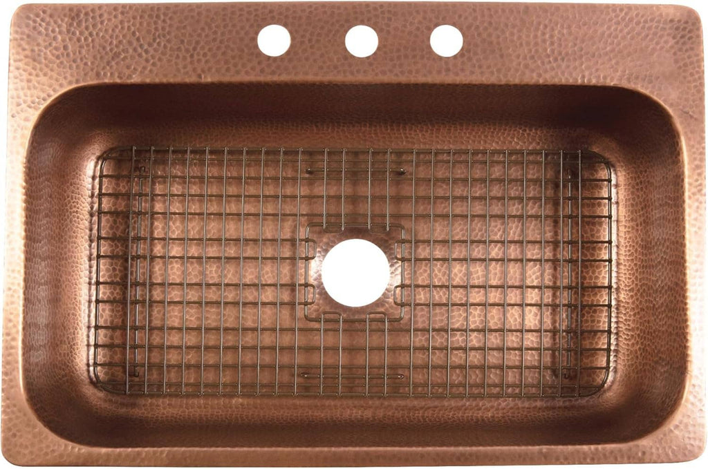 Antique brown kitchen sink bottom grid fitted inside a copper-colored sink