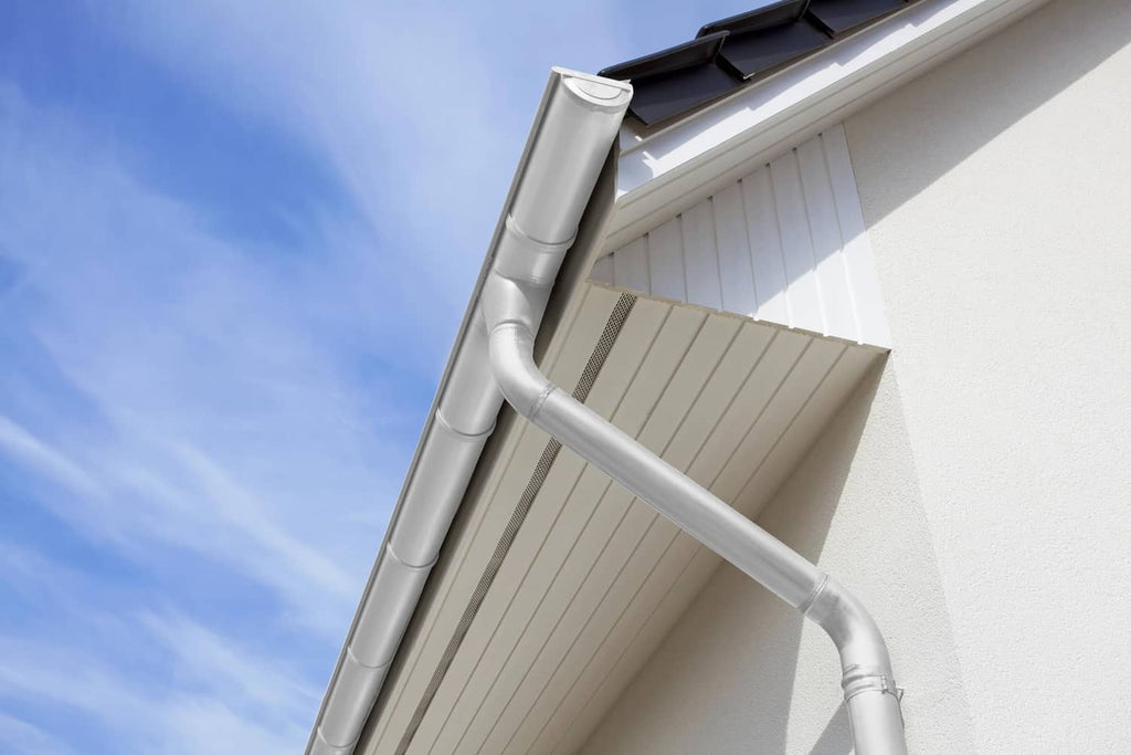 Coated metal gutter and downspout with cold galvanizing compound, silver-gray finish