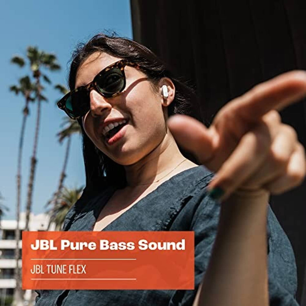 Black JBL true wireless earbuds in a person’s ear, compact in-ear fit