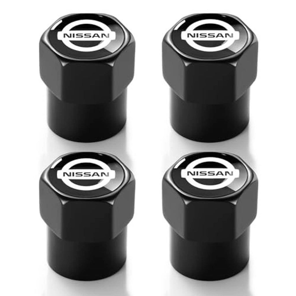 Four black metal Nissan valve stem caps with chrome-look tops and Nissan logo