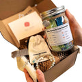 Bible verse jar gift set with beaded cross bracelet, shown in open kraft box