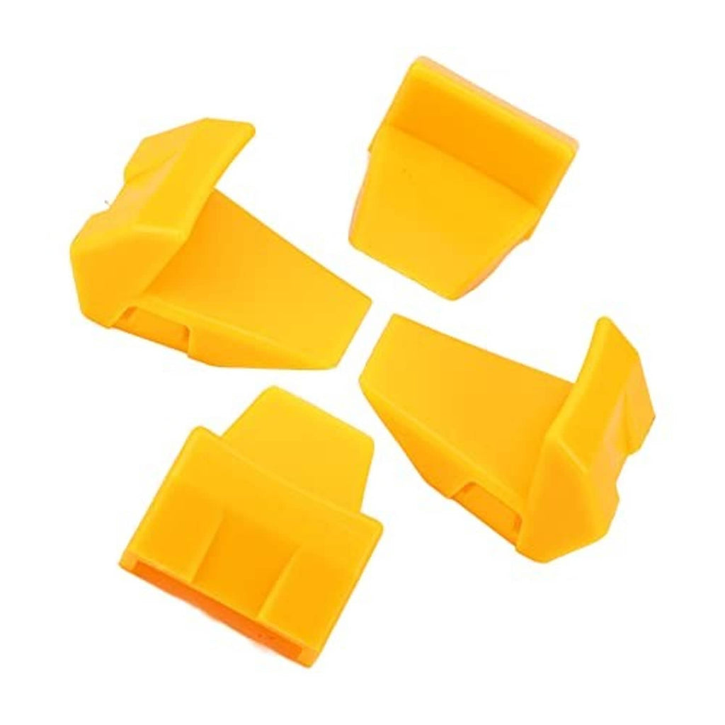 Four yellow jaw clamp protector inserts with open trough design, molded plastic.