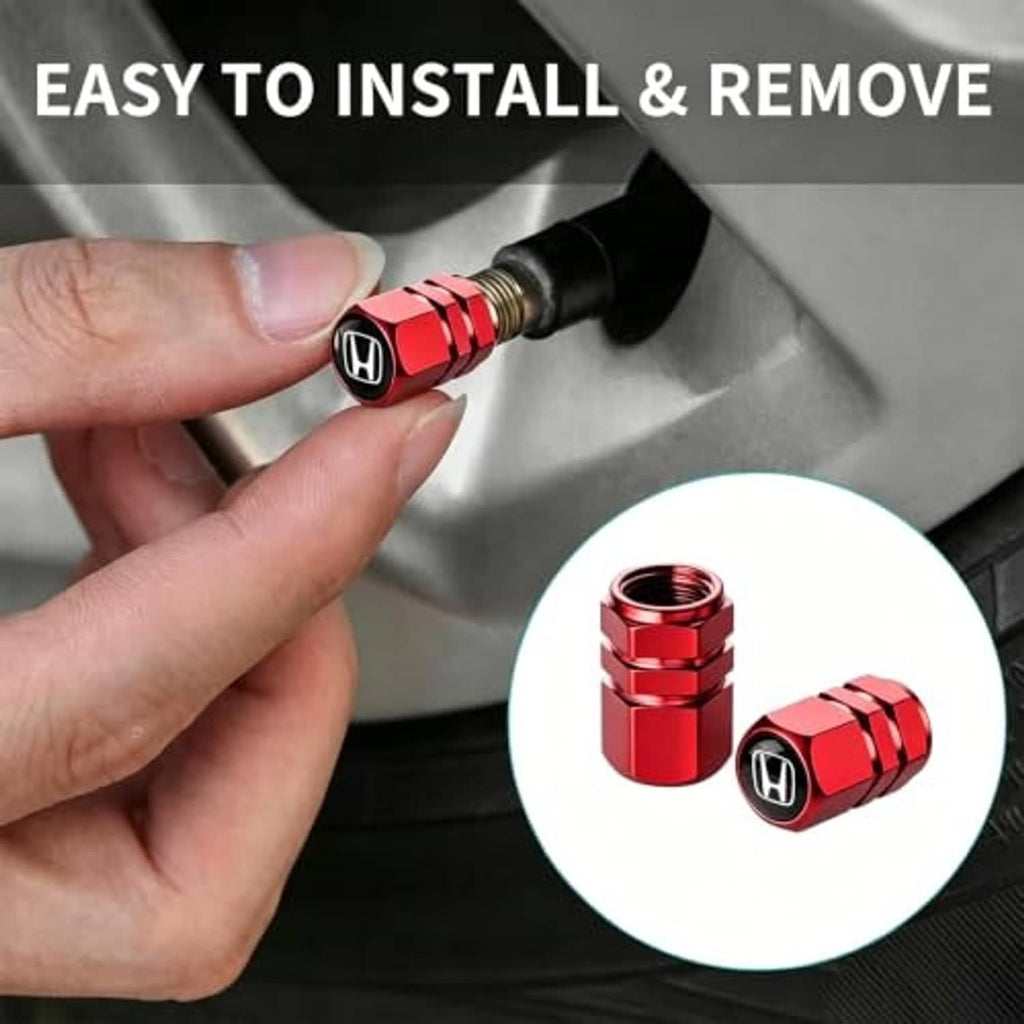Red tire valve stem cap being installed on a valve with visible threads and O-ring