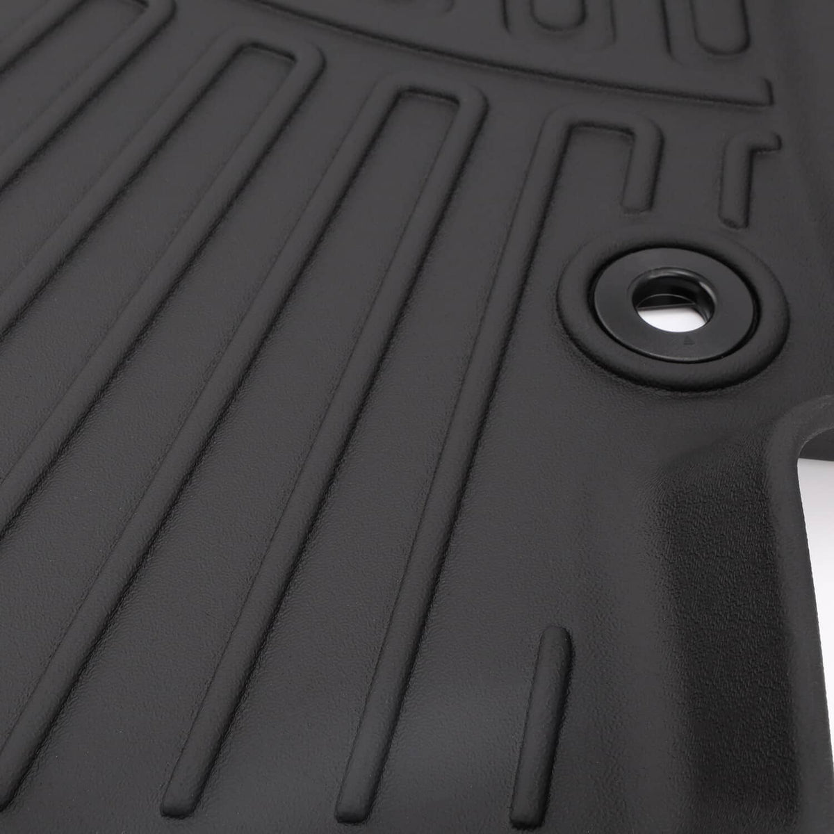 All-weather floor mat, black rubber with raised grooves and mounting grommet
