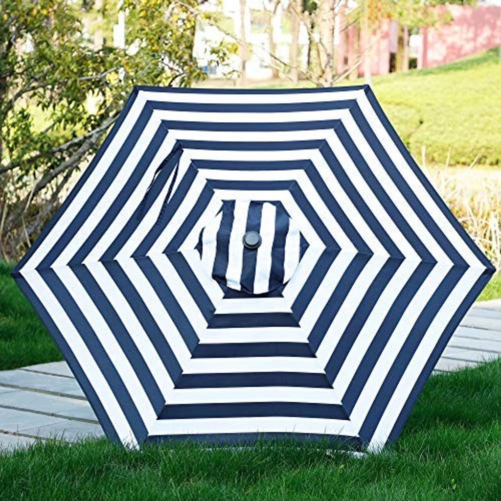 Navy-and-white striped patio umbrella canopy with octagon star-style pattern