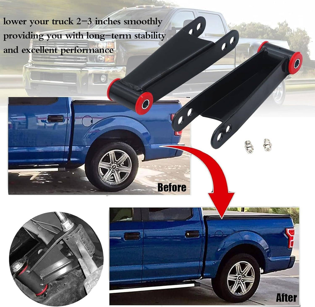 Two black rear drop shackles with red bushing sleeves shown for vehicle installation.