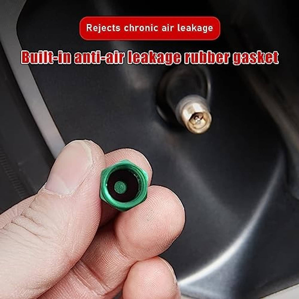 Green aluminum valve stem cap held in a hand, showing the threaded hex top
