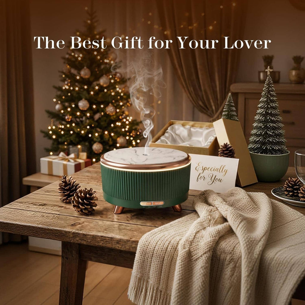 Teal essential oil diffuser with white top, copper legs, and visible mist plume