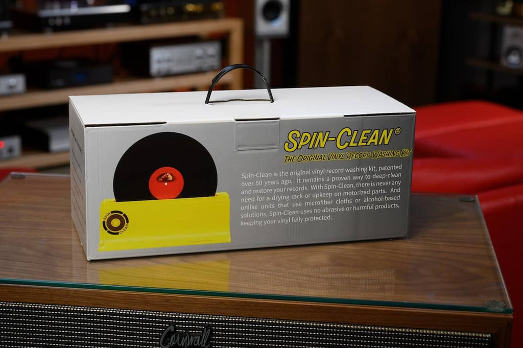Vinyl record cleaner kit box with included accessories on a table
