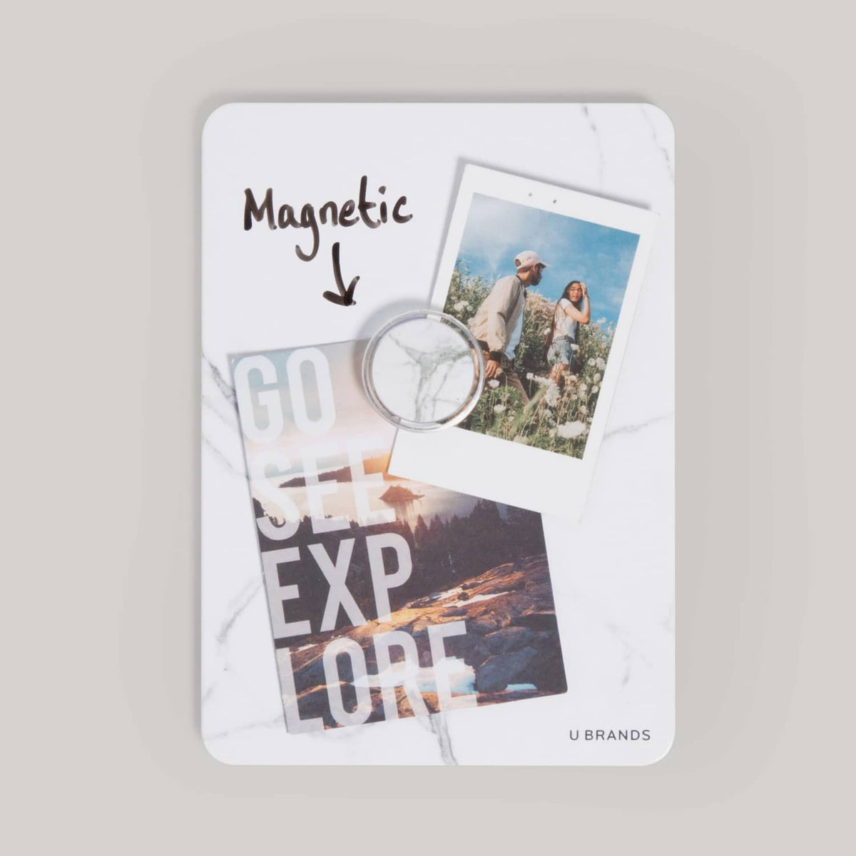 Magnetic mounting board with photo card and magnets holding prints in place