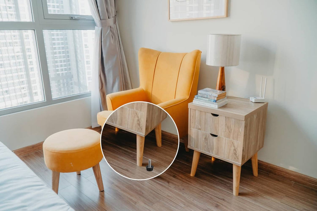 Black screw-in furniture leveler under wooden cabinet legs, with close-up circle
