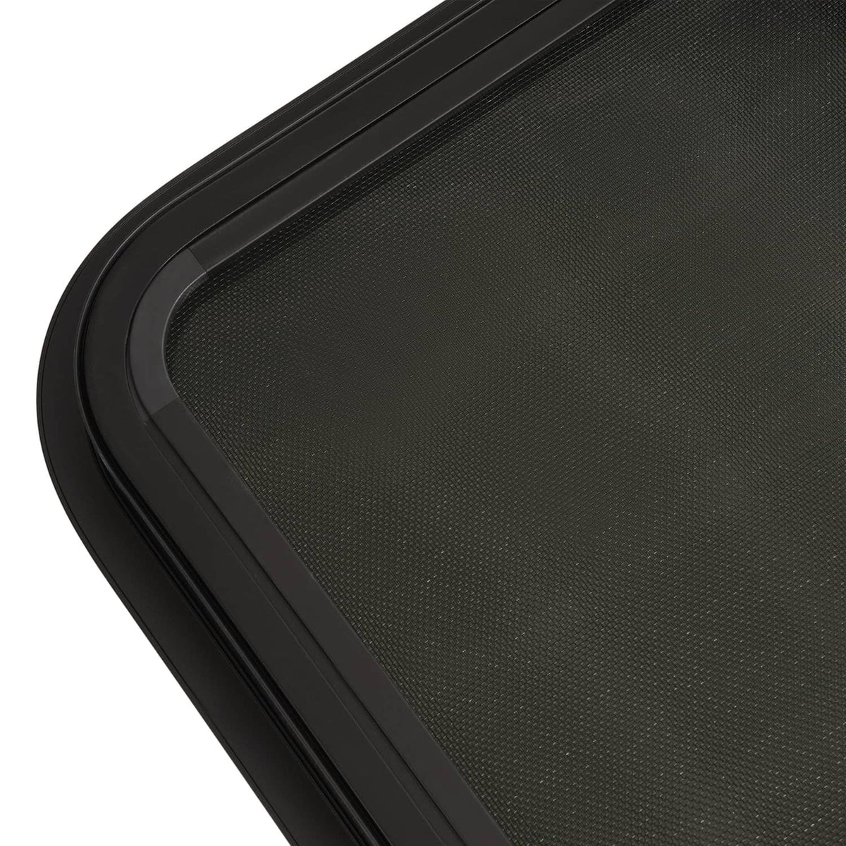 Close-up of black window trim frame with textured outer surface