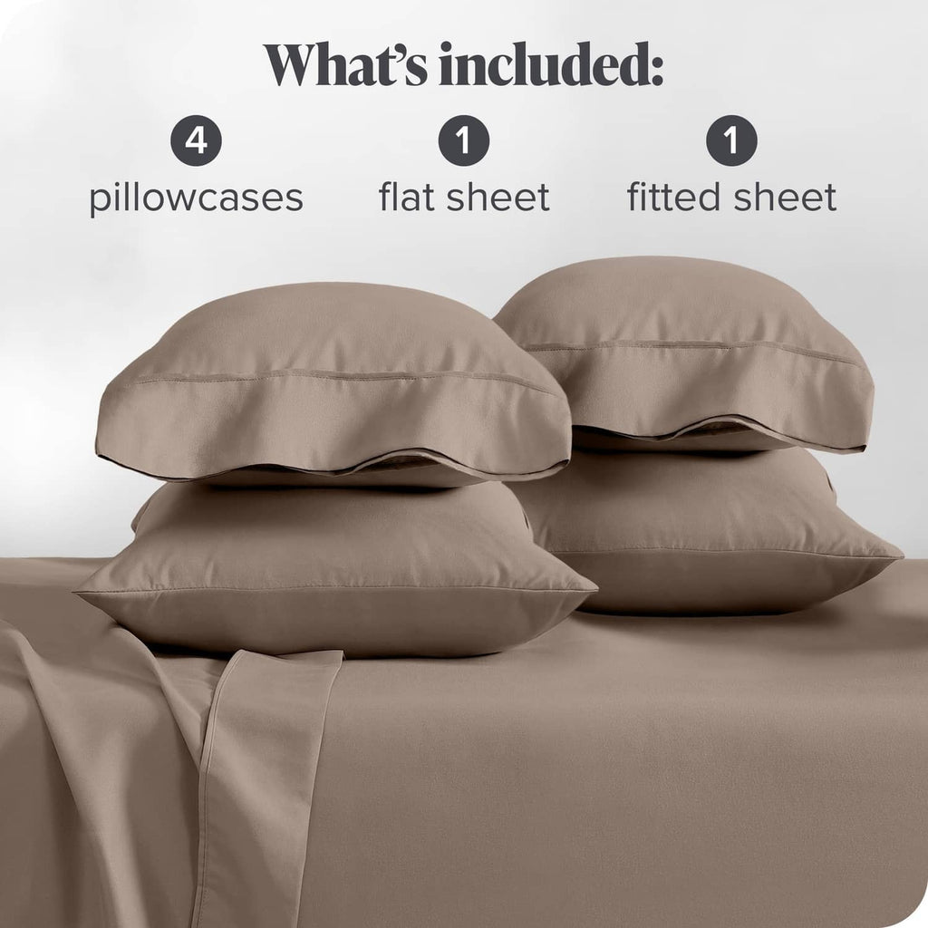 Taupe sheet set display: four pillowcases with one flat sheet and one fitted sheet.