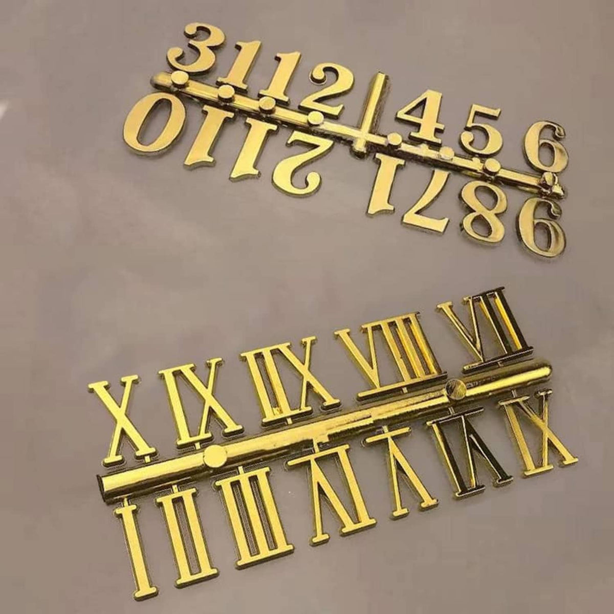 Gold clock numeral and Roman numeral hand set with raised embossed details