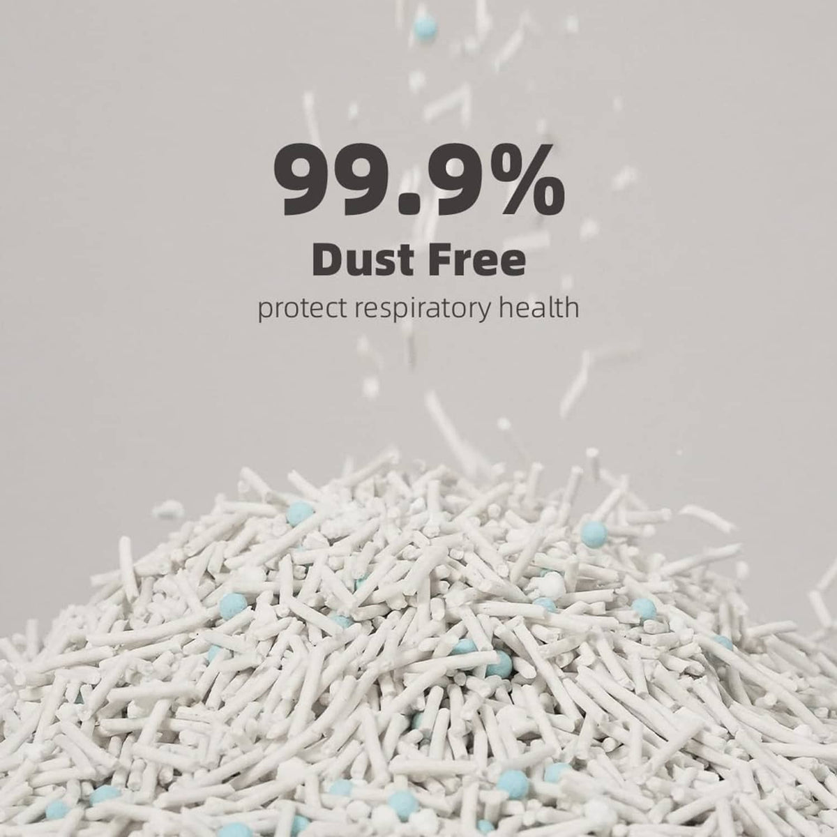 White cat litter pellets with small blue specks in a dust-free pile