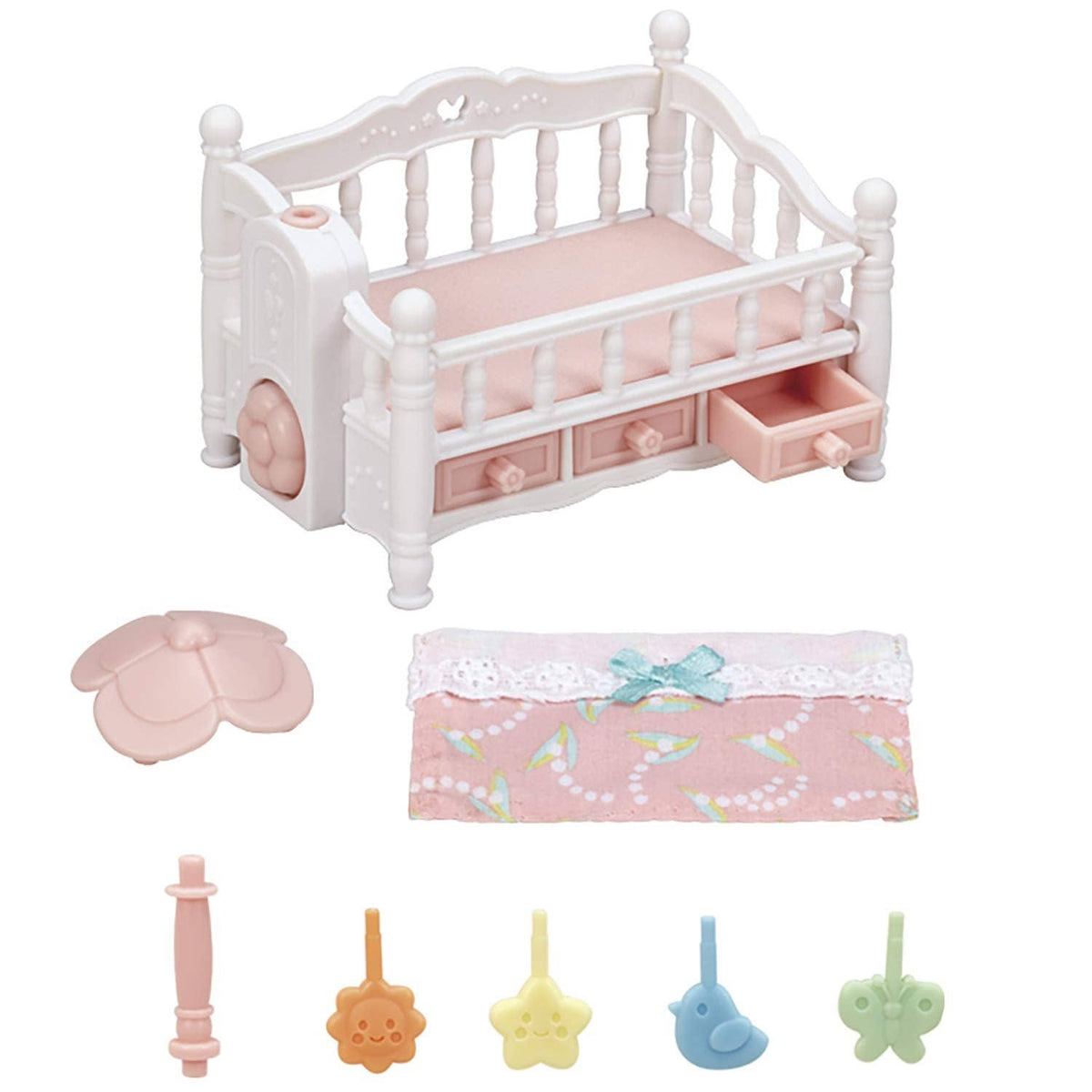 White dollhouse crib with pink bedding, mobile parts and bedding accessory pieces