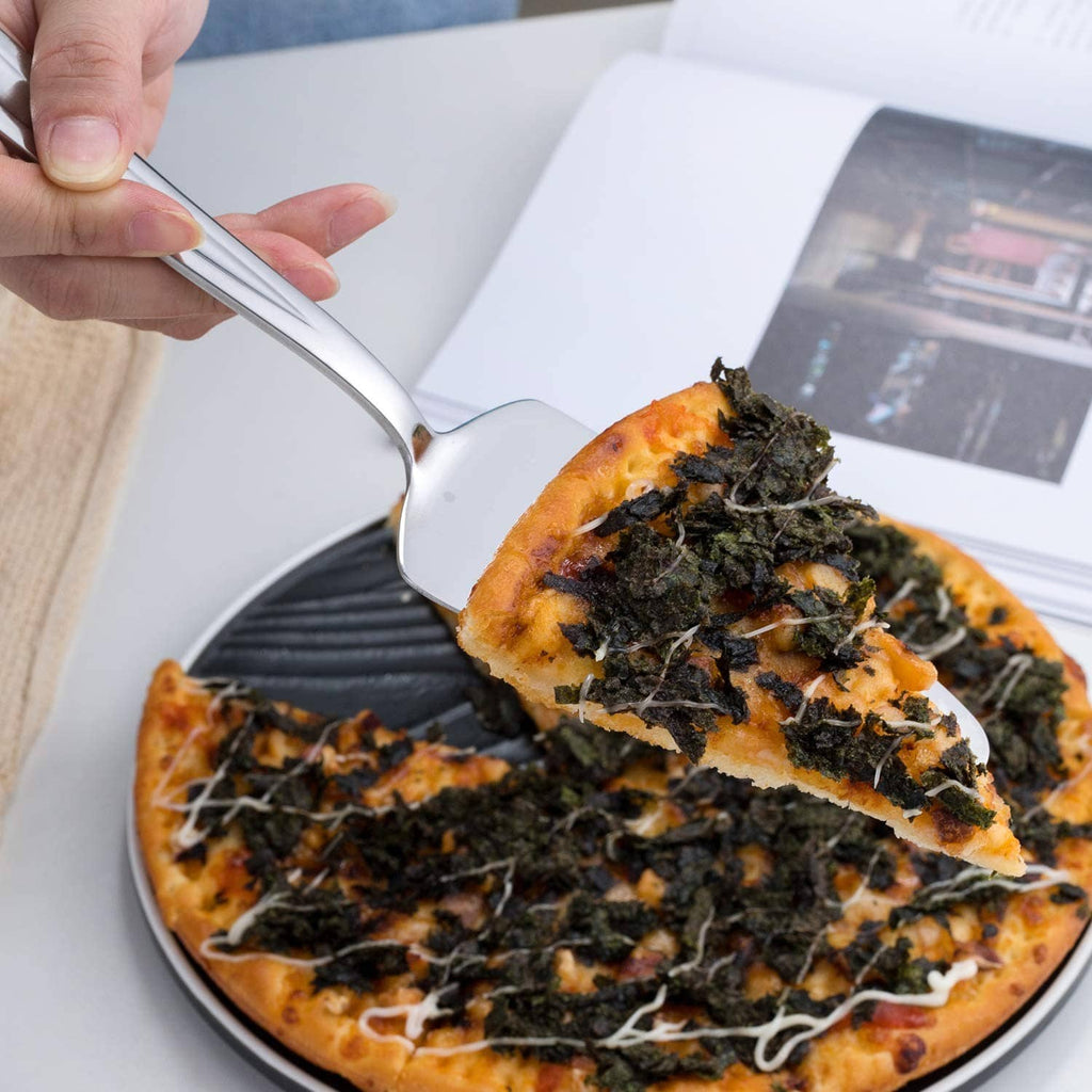 Hands holding a stainless pie cake server cutting a pizza slice with white blade