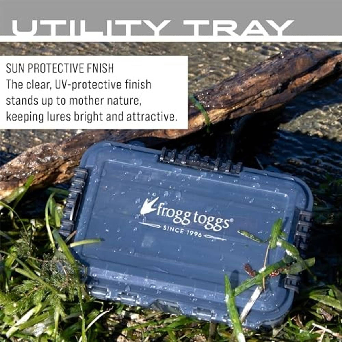 Waterproof utility box on rocks with clear lid and dark compartment trays
