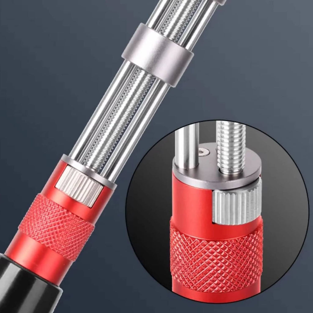 Adjustable watch back opener tool close-up: steel prongs, red textured grip