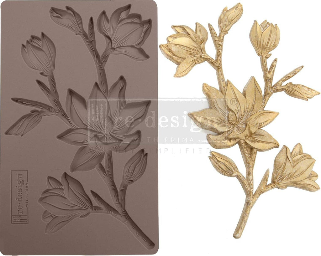 Floral embossing mold showing tulip and leaf relief with a gold flower cast