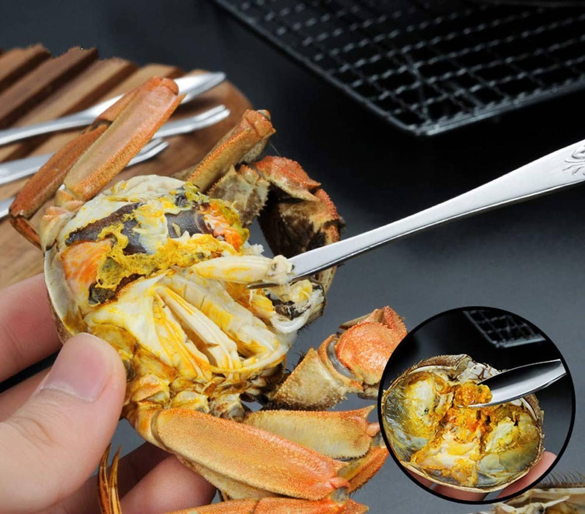 Metal seafood cracker opening crab on a grill rack, with ribbed jaws