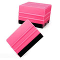 Pink vinyl squeegee tool with attached black felt edge, ready for decal and film application