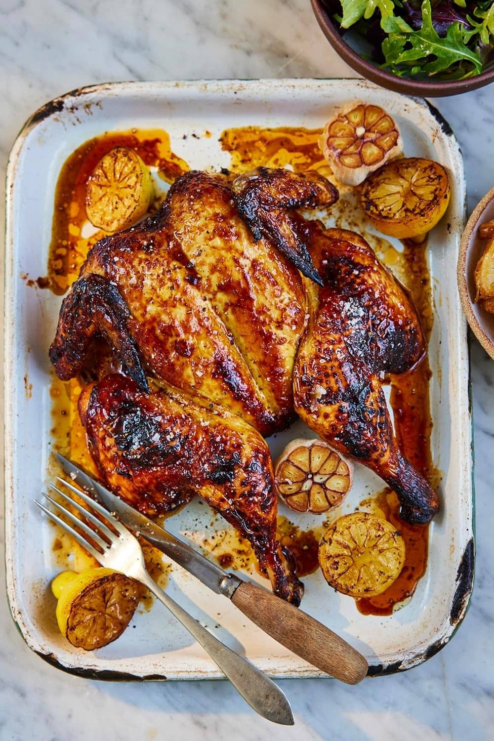 Smoked sea salt seasoning sprinkled on baked chicken in dish