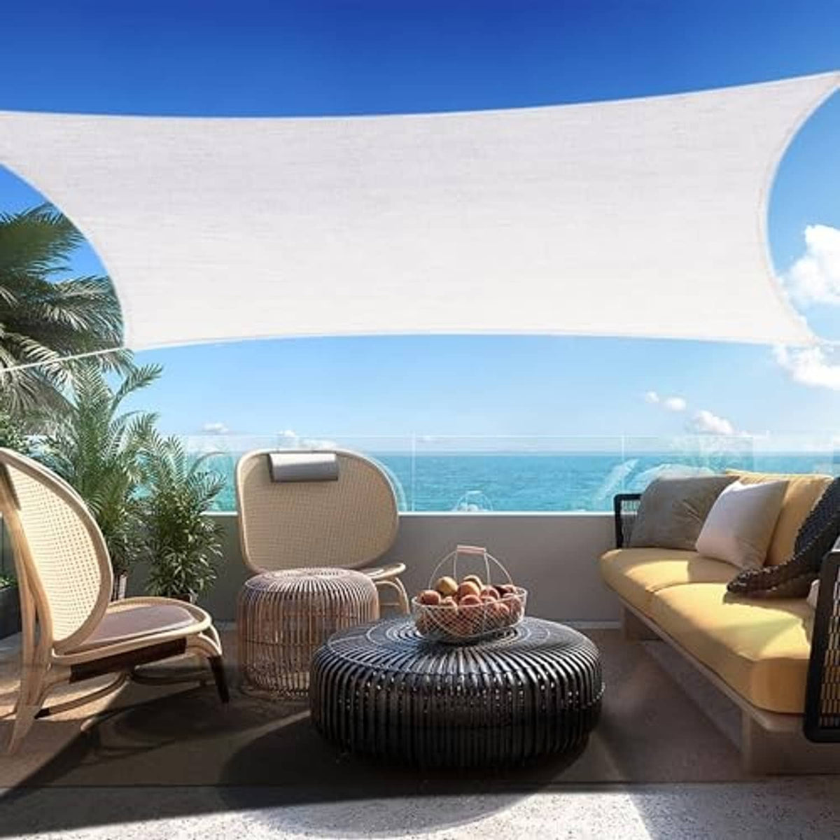 Off-white rectangular shade sail canopy with curved corners, hanging over patio seating.