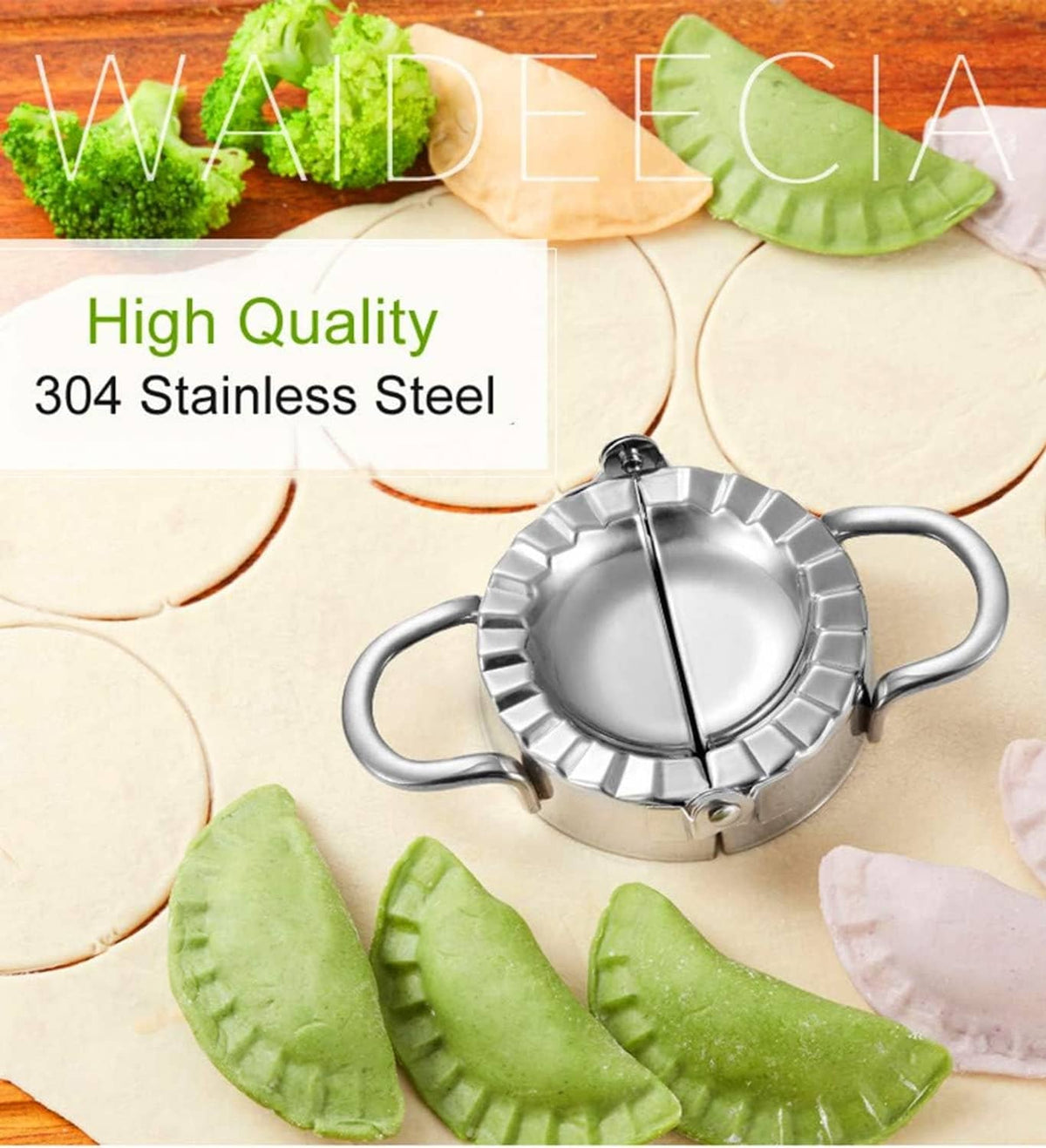 Stainless steel dumpling press on dough circles with green half-moon dumpling