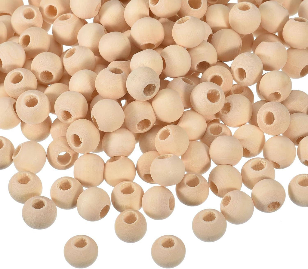Unfinished natural wood round spacer beads with hollow center holes, dense spread