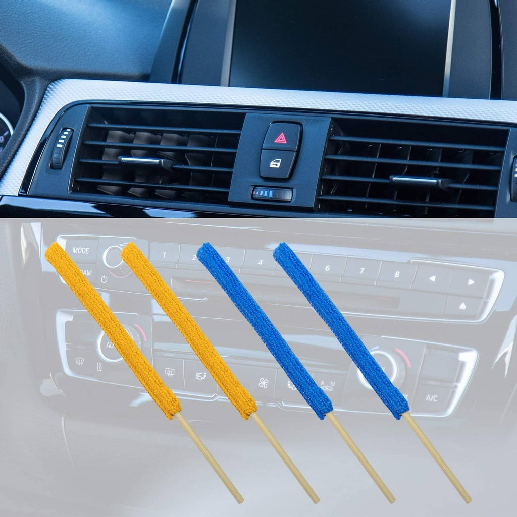 Multi-color microfiber duster sticks with wooden handles on a car air vent