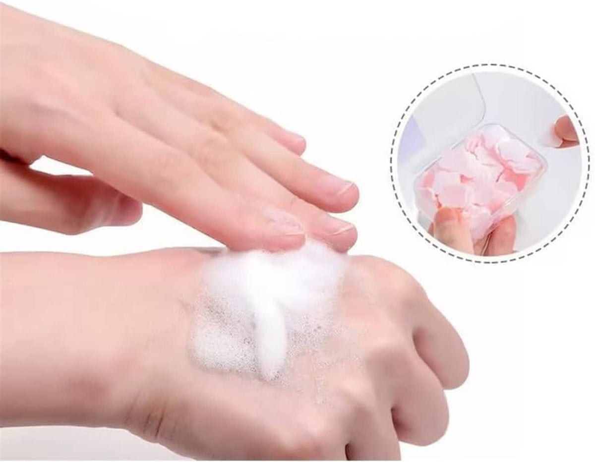 Hand washing with petal-shaped soap paper, visible foam on skin