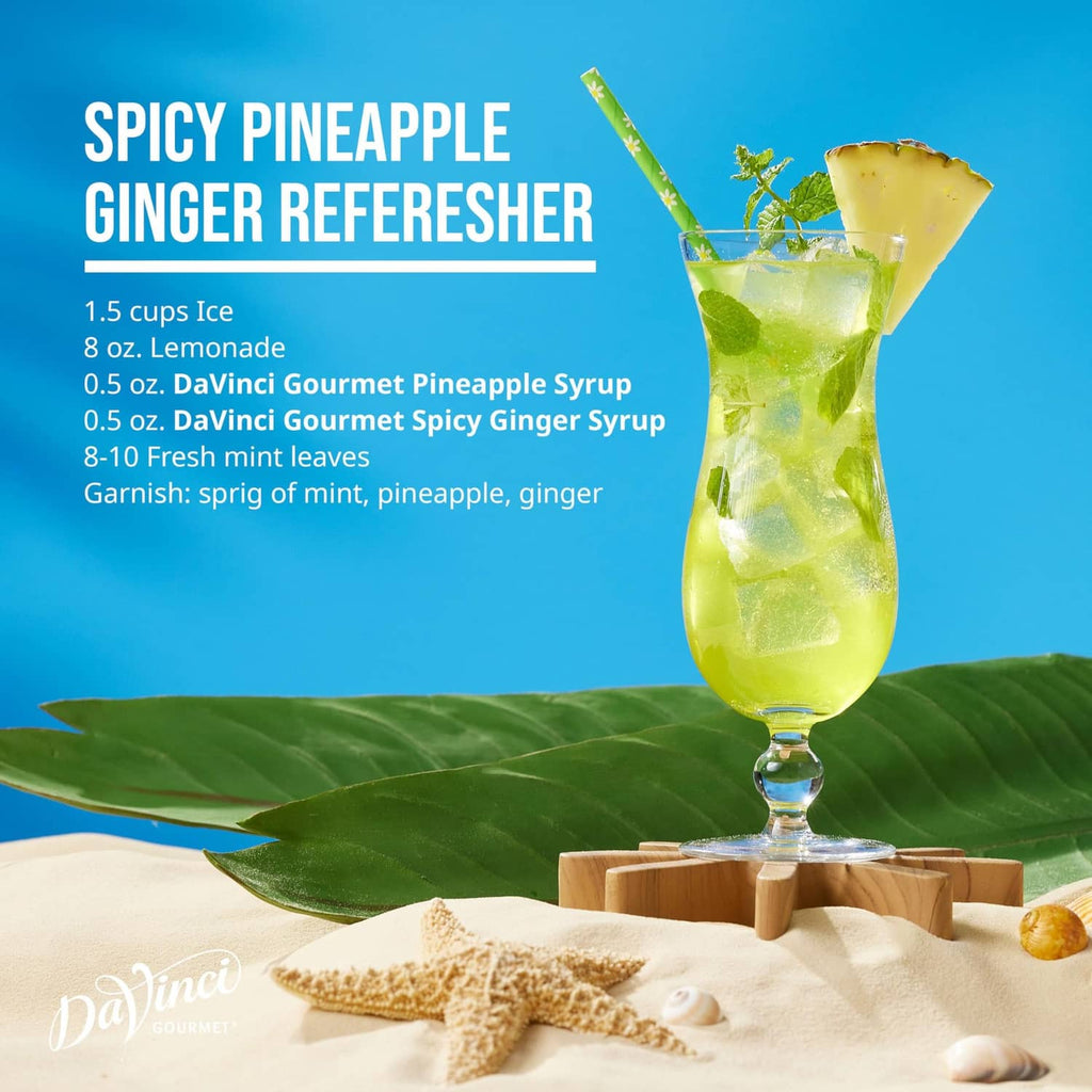 Spicy pineapple ginger refresher cocktail in stemmed glass with garnish