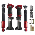 Set of red and black coilover suspension struts with springs and mounting brackets
