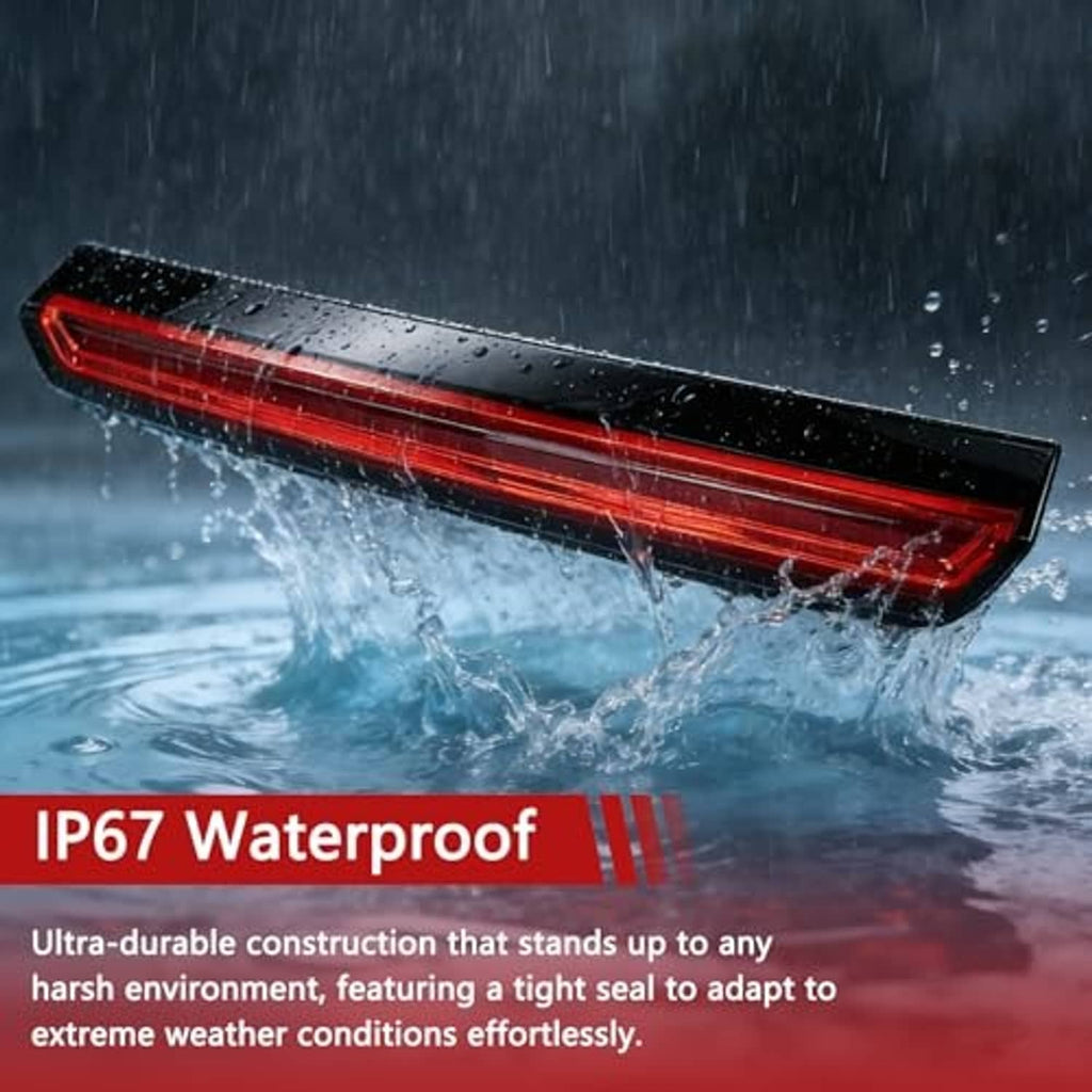 Water-resistant LED third brake light with red strip lens and black housing in rain