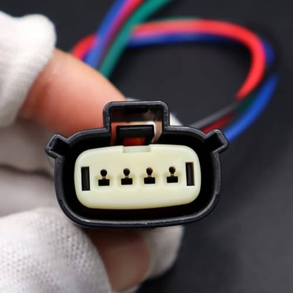 Close-up of multi-pin headlight connector socket with five pin holes