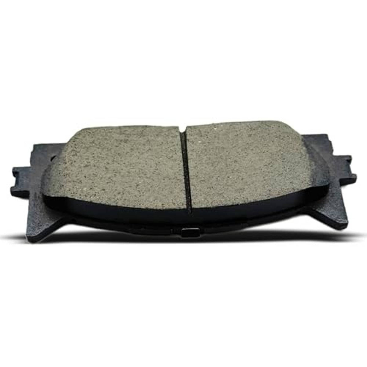Ceramic brake pad pair close-up, textured friction faces with center groove