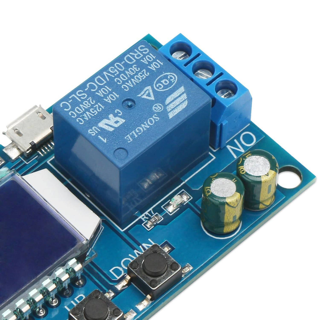 Close-up timer relay module showing relay and capacitors on blue circuit board