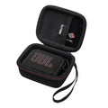 Black portable speaker case with zip closure, wrist strap, and JBL-branded inner pocket.