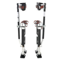 Adjustable drywall stilts with calf braces, dark frame, brown straps, and black foot pads