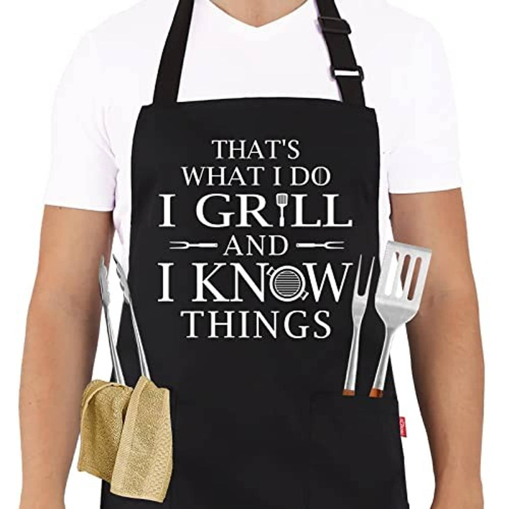 Black grilling apron with quote graphic and adjustable neck strap; two front pockets