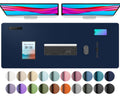 Dark blue desk pad protector with smooth surface and rounded corners for office use.