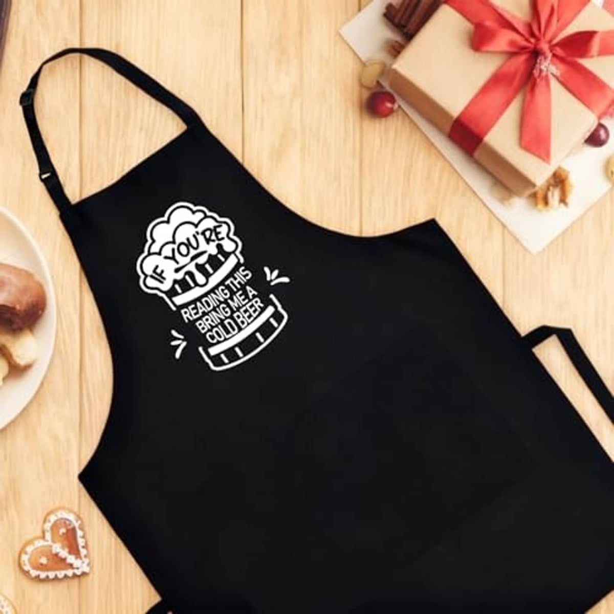 Black BBQ apron with beer quote logo and adjustable neck strap
