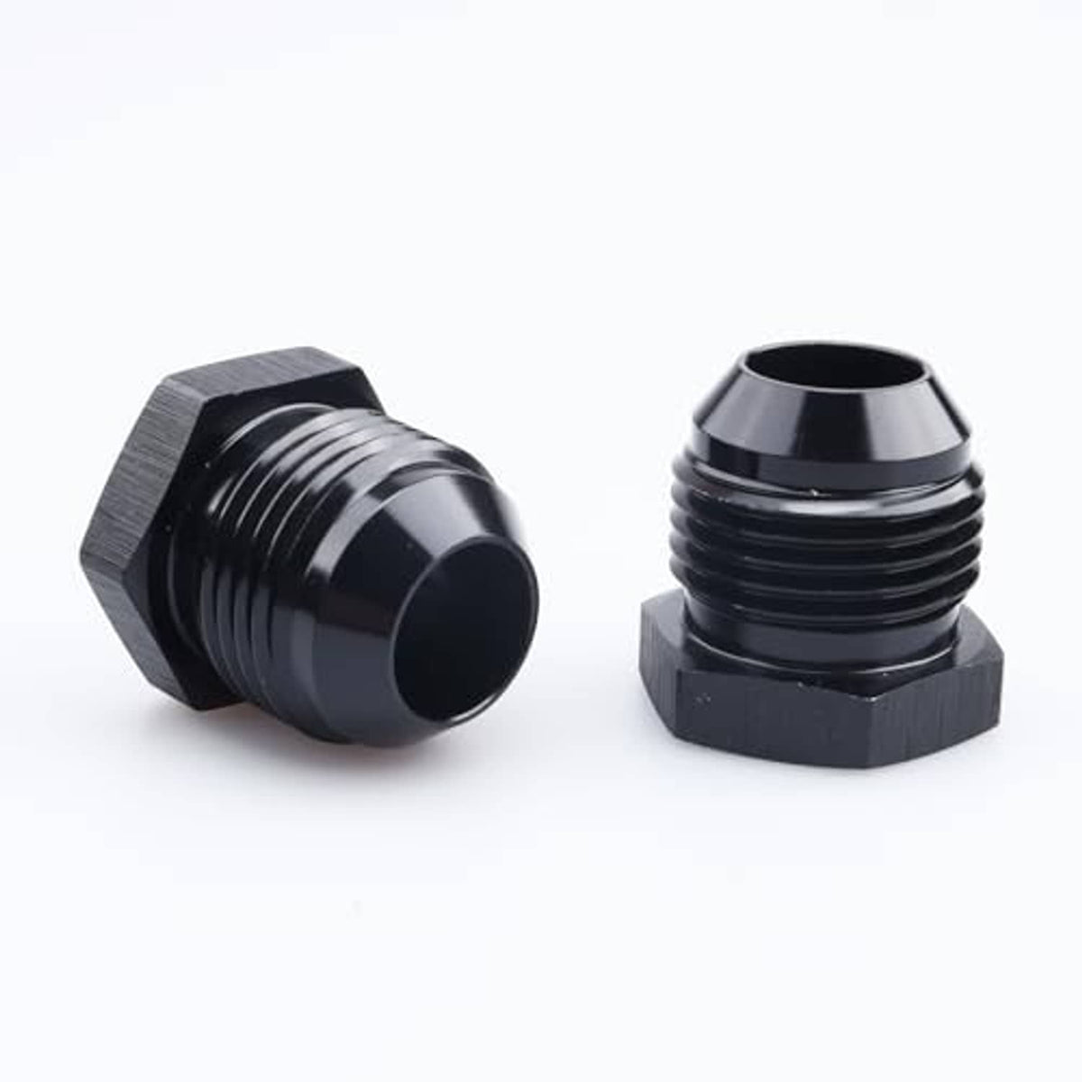 Black AN male flare blanking plug connectors angled view, threaded with hex caps
